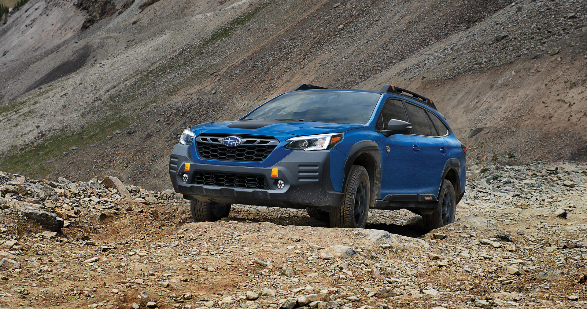 A 2023 Outback Wilderness driving on a trail in the mountains. | Goldstein Subaru in Colonie NY