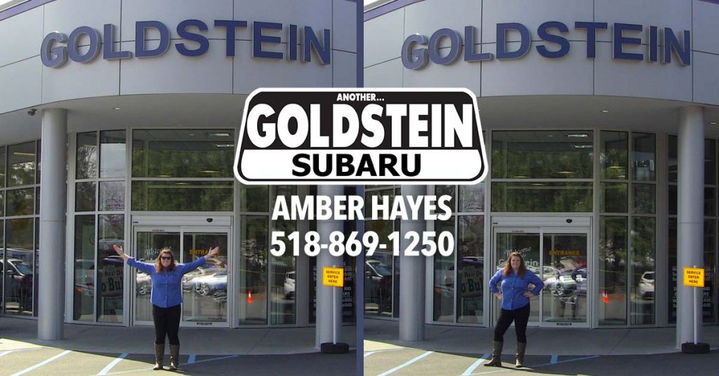 Amber stands in front of Goldstein Subaru in Albany, NY.