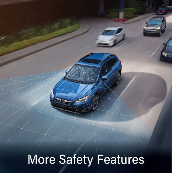 A Subaru Crosstrek in blue with the words “More Safety Features“. | Goldstein Subaru in Colonie NY