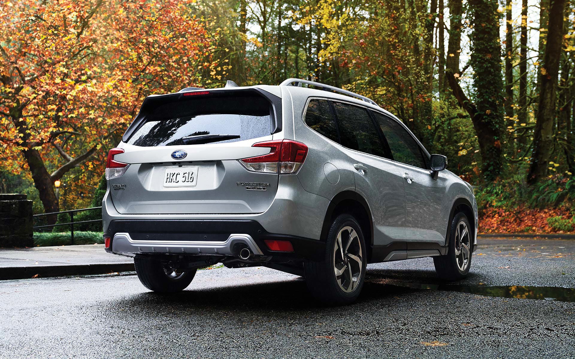 The rear of the 2022 Forester on a neighborhood street. | Goldstein Subaru in Colonie NY