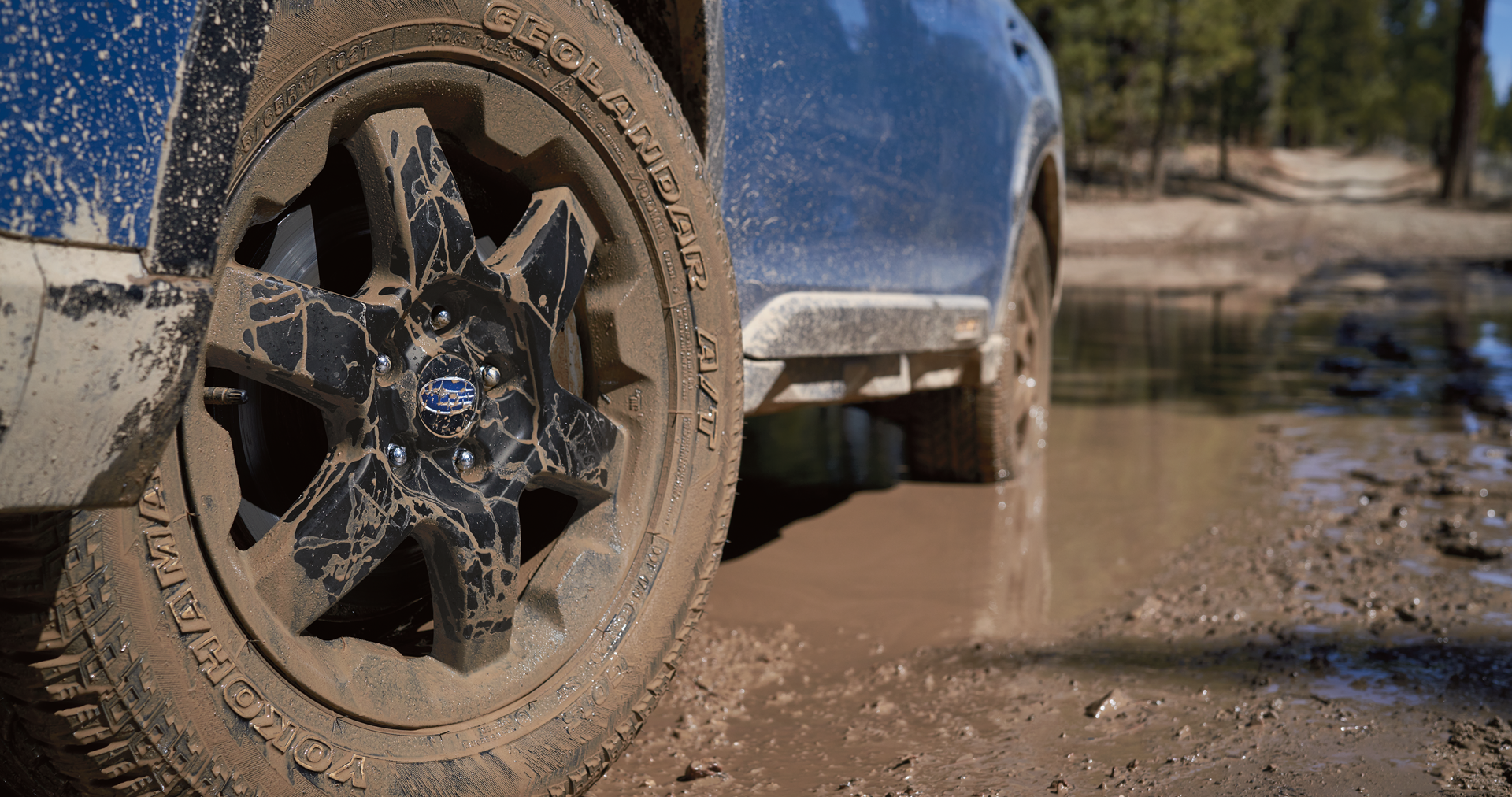 A close-up of the 17-inch off-road wheels and all-terrain Yokohama GEOLANDAR® tires on the 2023 Outback Wilderness. | Goldstein Subaru in Colonie NY
